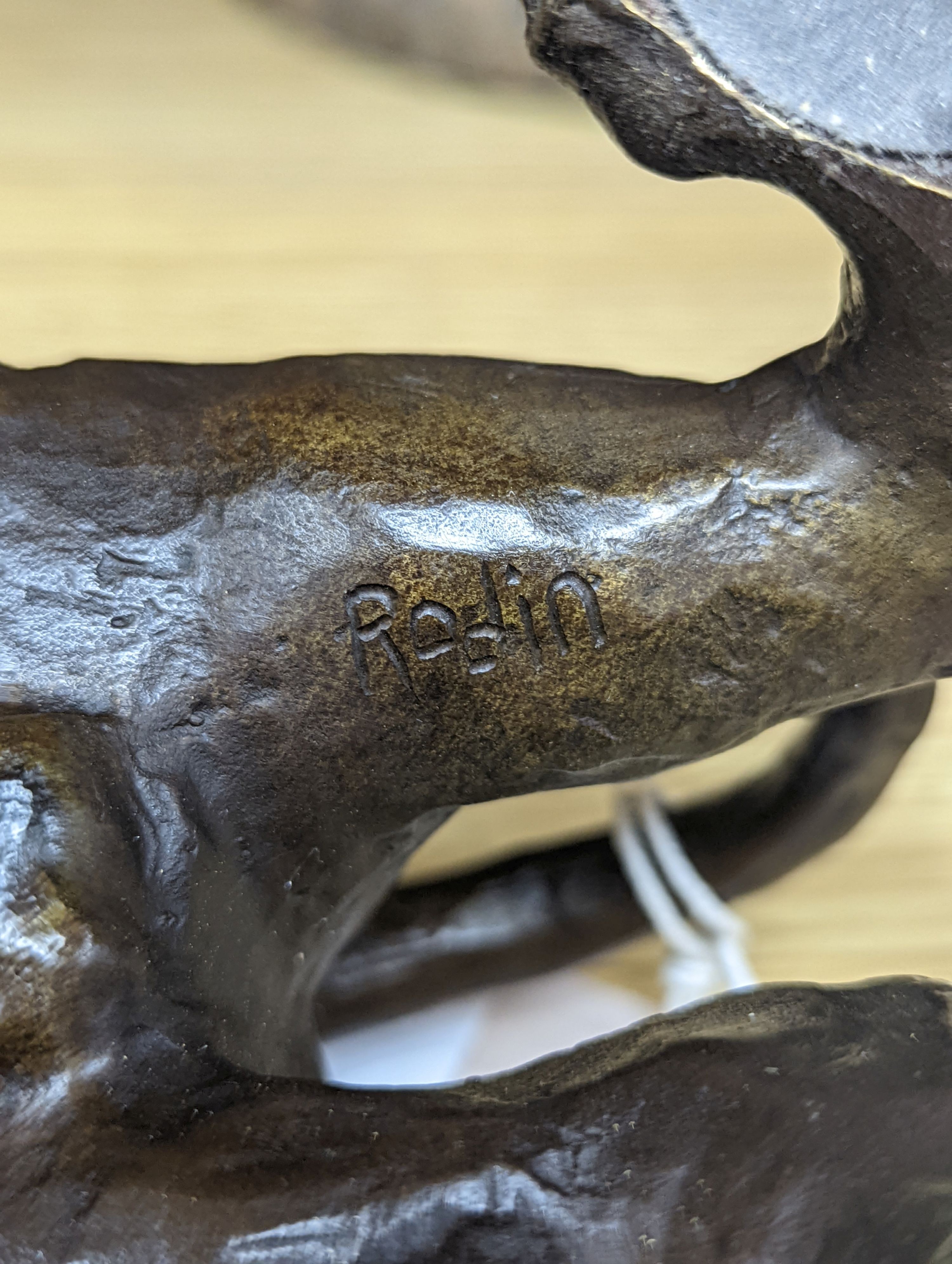 A bronze lion, bearing a signature, Rodin, 31cm.